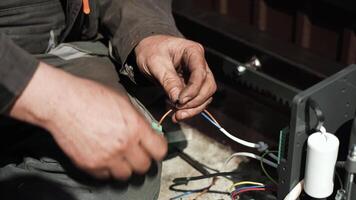 Electrician installs wiring using Connectors for connecting wires in automation and electronics equipment. Connection of electrical wires of electrical appliances video