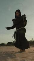 Monk Does Jump Rope Sport Training On The Sand Dunes video