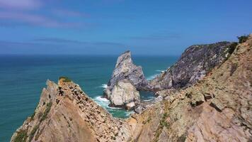 Ursa Beach, Sea Stacks, Cliffs and Atlantic Ocean Waves on Sunny Day. Portugal. Aerial View. Drone Moves Forward video