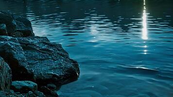 The soothing blue water reflects the moonlight creating a calming and dreamy atmosphere for a tranquil swim. video