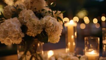 Delicate flower arrangements were illuminated by the soft light of the candles adding a touch of elegance and sophistication to the outdoor studio. video