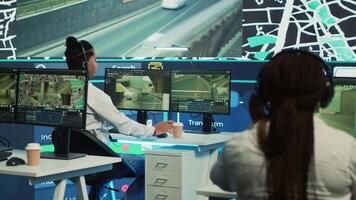 Call center operators providing shipment information via gps satellite map for their clients, ensuring fast delivery. Employees locating their drivers with coordinates, monitoring traffic. Camera A. video