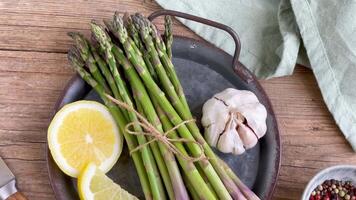 Array of Asparagus, Lemon, Garlic, Pepper on Plate video