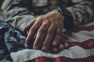 A man in a military uniform is holding a hand on a flag photo