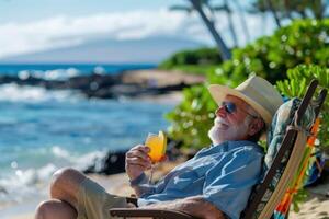 A man is sitting on a beach chair with a drink in his hand photo