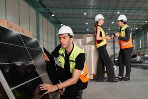 man in a yellow vest is looking at a solar panel photo