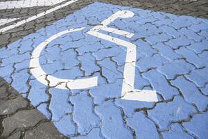 Disabled sign on the asphalt photo