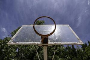 Basketball basket in a field photo