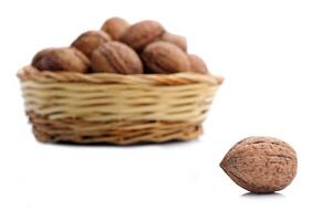 Wicker basket with walnuts photo