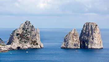 Faraglioni, famous giant rocks, Capri island photo