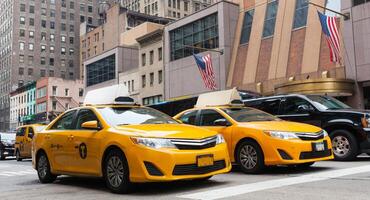 Classic street view of yellow cabs in New York city photo