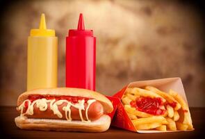 Fresh and tasty hot dog with fried potatoes photo