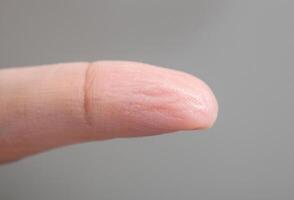 Wrinkled skin of finger photo