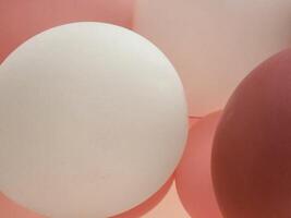 Pink and white balloons. Background with balloons photo