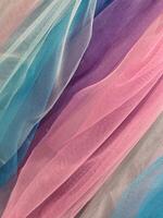 Thin cloth. Thin translucent colored fabric. Fabric background photo