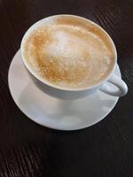 White coffee cup. Cup of coffee on a black background photo