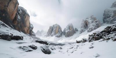 Cloud day rock hill mountain rock peak with snow at winter. Adventure expedition travel hiking scene view photo