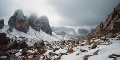 Cloud day rock hill mountain rock peak with snow at winter. Adventure expedition travel hiking scene view photo