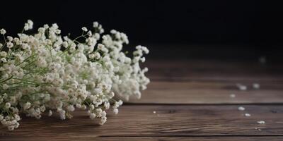 Small white flowers gypsophila on wood table scene. Decorative romantic elegance mock up background photo