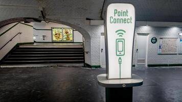 Modern public charging station Point Connect in a Paris metro station, highlighting urban connectivity and infrastructure, Paris, France, April 14th, 2024 photo