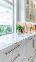 Modern monochromatic kitchen with white quartz countertops and panoramic city view photo