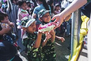 Chiang Mai, Thailand - January 14, 2023 Children's Day activities in Thailand in January of every year include snacks, food, dancing, and various rides. photo