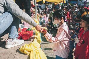 Chiang Mai, Thailand - January 14, 2023 Children's Day activities in Thailand in January of every year include snacks, food, dancing, and various rides. photo