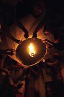 Chiang Mai - Thailand November 27, 2023  Tourists happily celebrate releasing lanterns at the Loi Krathong Yi Peng Lantern Festival according to Thai cultural traditions. photo