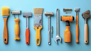 Tools of different shapes and sizes arranged in a neat lineup illustrating the range of tasks needed for a successful home renovation photo