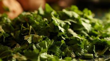 The scent of freshly chopped cilantro fills the air as its added to the other ingredients photo