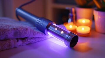 An infrared light wand emitting healing wavelengths being gently massaged over eczema patches. photo