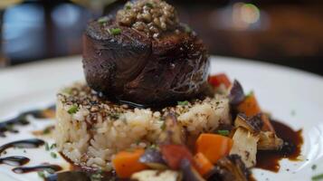The main course a succulent filet mignon cooked to perfection is accompanied by a decadent truffle risotto and a side of perfectly roasted vegetables photo
