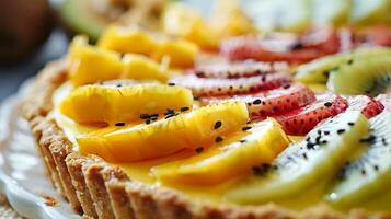 A tropical fruit tart with a buttery crust filled with a creamy coconutlime custard and topped with slices of exotic fruit photo