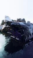Wrecked plane on craggy island coastline video