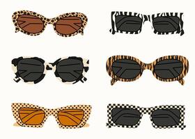A set of sunglasses with an animalistic pattern. Summer sunglasses, fashionable eyeglass frames. Various shapes and styles. Hand drawn flat style. Women's beach accessories in a modern style. vector