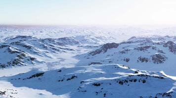 A snow-covered mountain range with majestic peaks in the background video