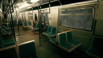 An empty subway car with blue seats in the metro underground video
