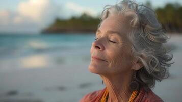 A lone retiree finds inner peace on a deserted beach her powerful tree pose reflecting the strength and tranquility of the surrounding sea photo