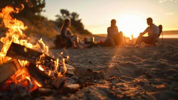 As the sun dips below the horizon a group sits around a beach fire pit swapping stories and cooking up a storm with their catch of the day photo