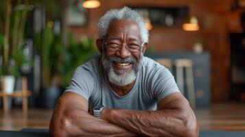 An older gentleman beaming with joy as he completes a challenging plank exercise in a virtual fitness class surrounded by his supportive online classmates photo