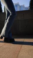 Female Legs in Jeans and Black Shoes Walk in the Sunset Light. video