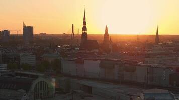 Aerial panoramic sunset over Riga old town in Latvia. Beautiful spring sunset over Riga. Golden hour fire sunset. video
