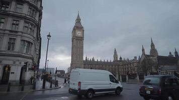 London, United Kingdom - April 2, 2024 - Big Ben Houses of Parliament the Palace of Westminster, and iconic AEC Routemaster red double-decker buses video