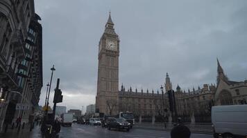 London, United Kingdom - April 2, 2024 - Big Ben Houses of Parliament the Palace of Westminster, and iconic AEC Routemaster red double-decker buses video