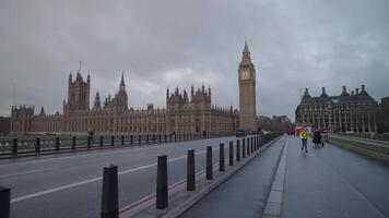 London, United Kingdom - April 2, 2024 - Big Ben Houses of Parliament the Palace of Westminster, and iconic AEC Routemaster red double-decker buses video