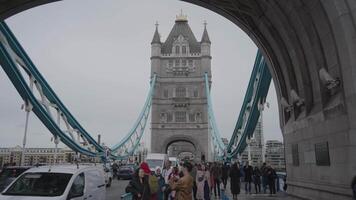 London, United Kingdom - April 2, 2024 - Girl with a Dolphin FountainTower Bridge bascule and suspension bridge over River Thames video