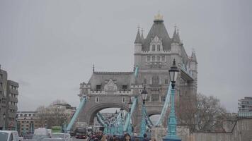 London, United Kingdom - April 2, 2024 - Girl with a Dolphin FountainTower Bridge bascule and suspension bridge over River Thames video