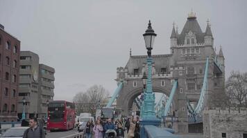 London, United Kingdom - April 2, 2024 - Girl with a Dolphin FountainTower Bridge bascule and suspension bridge over River Thames video