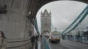 London, United Kingdom - April 2, 2024 - Girl with a Dolphin FountainTower Bridge bascule and suspension bridge over River Thames video