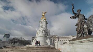 London, United Kingdom - The Victoria Memorial monument to Queen Victoria stands in front of Buckingham Palace video